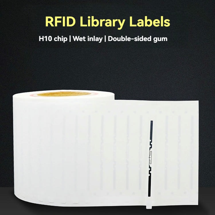 Ova slika prikazuje rolnu lepljivi antenski umetak RFID etiketa za biblioteke koja je odmotana tako da se vidi jedan tamni uzorak antene na prednjoj traci.
